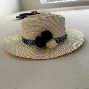 Saks Fifth Avenue Straw Hat with black and white pompoms and embroidered design